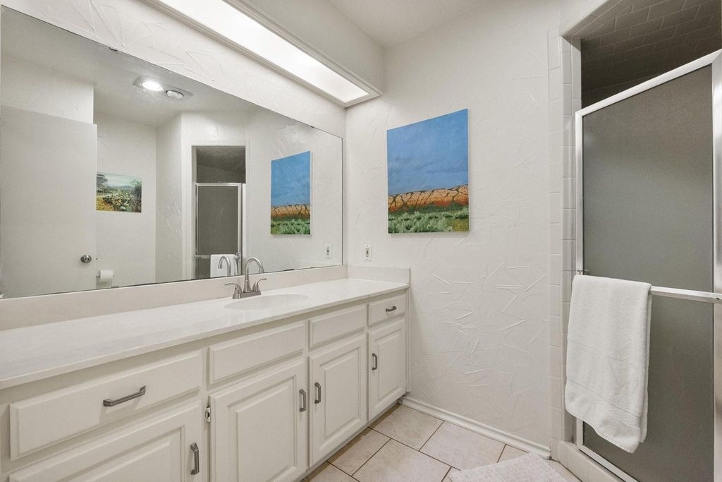 Bathroom with Quartz Vanity & Step-In Shower
