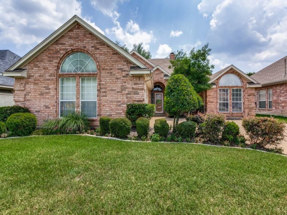 Brick home exterior with updated siding and paint